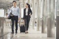 Business man and woman  Dragging suitcase luggage bagourist men Royalty Free Stock Photo