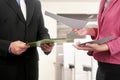 Business man and woman hand holding clipboard and paper
