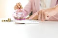 Business man woman hold collect coin in the row in Royalty Free Stock Photo