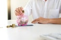 Business man woman hold collect coin in the row in Royalty Free Stock Photo