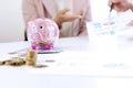 Business man woman hold collect coin in the row in Royalty Free Stock Photo