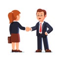 Business man and woman shaking hands firmly