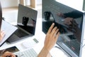 business man and woman sit at the table looking at computer