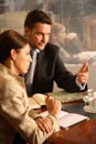 Business man and woman talking in the office Royalty Free Stock Photo