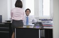 Business man and woman talking in office smiling Royalty Free Stock Photo