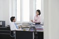 Business man and woman talking in office smiling Royalty Free Stock Photo