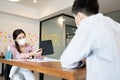 Business man and woman wearing face mask meeting and working together for discussion and brainstrom to get ideas