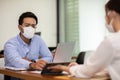 Business man and woman wearing face mask meeting and working together for discussion and brainstroming Royalty Free Stock Photo