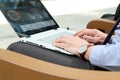 Business man working and analyzing financial figures on a graphs on a laptop outside. Royalty Free Stock Photo