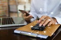 Business man working on calculator to calculate financial data report, accountancy document and laptop computer at office, Royalty Free Stock Photo