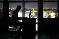 Business man working on a computer in the office at night. Royalty Free Stock Photo