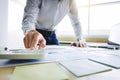 Business man working on business documents, calculator and laptop at a workplace Royalty Free Stock Photo