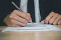 Businessman signing documentsBusiness man working with documents in the office