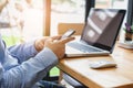 Business man at working with financial reports and using mobile smartphone in the office Royalty Free Stock Photo