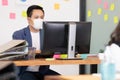 Business man working job on labtop and wering mask in office Royalty Free Stock Photo