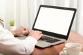 Business man working on laptop computer at home while sitting the wooden table.Male hands typing on the notebook keyboard.Online Royalty Free Stock Photo