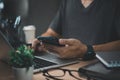 business man working on laptop computer and using mobile phone on desk digital technology concept Royalty Free Stock Photo