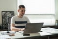 Business man working on a laptop at his desk in the office Royalty Free Stock Photo