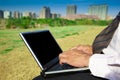 Business man working on a laptop outdoors Royalty Free Stock Photo