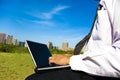 Business man working on a laptop outdoors Royalty Free Stock Photo