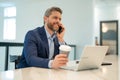 Business man working in office. Businessman in casual suit using laptop in office. Business man office worker in formal Royalty Free Stock Photo