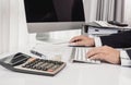 Business man working at office with desktop computer and documents on his desk Royalty Free Stock Photo