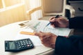 Business man working at office with documents on his desk Royalty Free Stock Photo