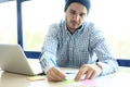 Business man working at office with laptop and documents on his desk Royalty Free Stock Photo