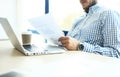 Business man working at office with laptop and documents on his desk Royalty Free Stock Photo