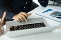 Business man working at office with laptop and documents on his desk, financial adviser analyzing data Royalty Free Stock Photo