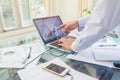 Business man working on open laptop at home office