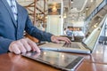 Business man working using Ipad while working with laptop Royalty Free Stock Photo
