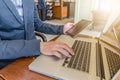 Business man working using Ipad while working with laptop Royalty Free Stock Photo