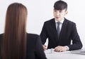 Business manager interviewing young women job applicant in the office Royalty Free Stock Photo