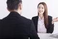 Business manager interviewing young women job applicant in the office Royalty Free Stock Photo