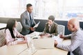 Business manager supervising his staff during a morning meeting Royalty Free Stock Photo