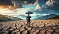 business manager with umbrella in the middle of dry cracked ground Royalty Free Stock Photo