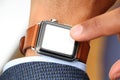 Business' mans hand with a smart watch