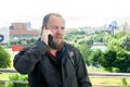 Business mature male tourist with a beard talking on the phone Royalty Free Stock Photo