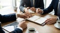 Business Meeting Around Table With Notebook, Tablet and Coffee During Team Discussion Royalty Free Stock Photo