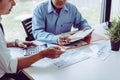 Business meeting asian people two male middle-age discussing while sitting together Royalty Free Stock Photo