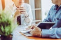 Business meeting asian people two male middle-age discussing while sitting together Royalty Free Stock Photo