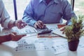 Business meeting asian people two male middle-age discussing while sitting together Royalty Free Stock Photo