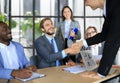 Business meeting associates shaking hands in office. Royalty Free Stock Photo