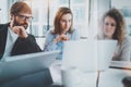 Business meeting concept.Coworkers team working with mobile computer at modern office.Blurred background.Horizontal.