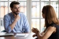 HR manger listening female applicant during job interview Royalty Free Stock Photo