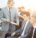 Business meeting - manager discussing work with his colleagues Royalty Free Stock Photo