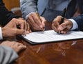 Business Meeting with Multiple People Signing Documents Royalty Free Stock Photo