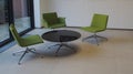 Business meeting room three green chairs and round table Royalty Free Stock Photo