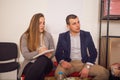 Business meeting between three guy and a girl at a pleasant office spot